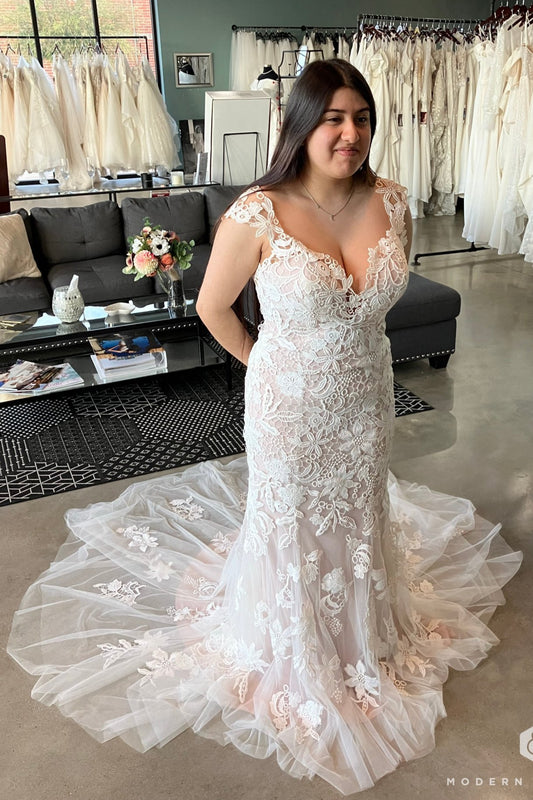 Model Destiny wearing Justin Alexander discontinued white wedding dress, 6617. 